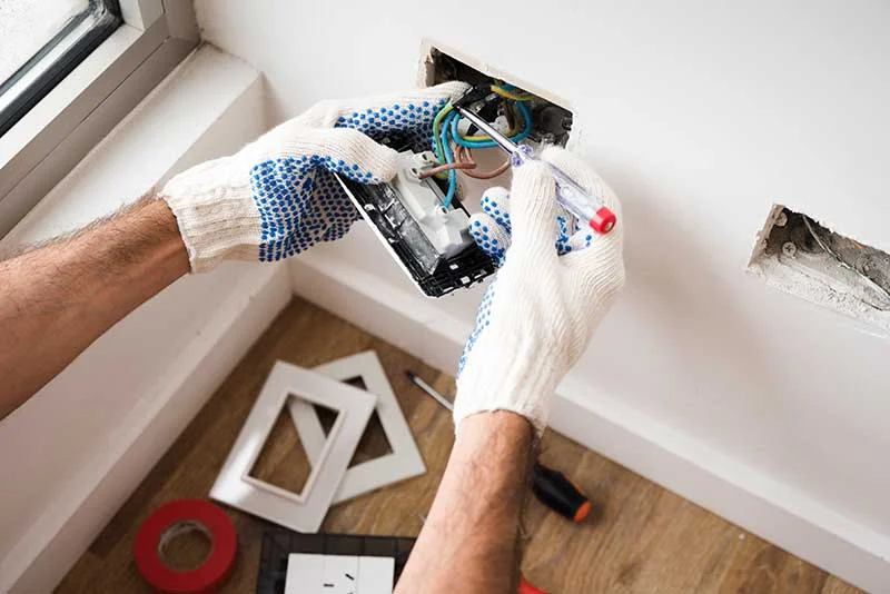 Close-up of electrical socket installation work